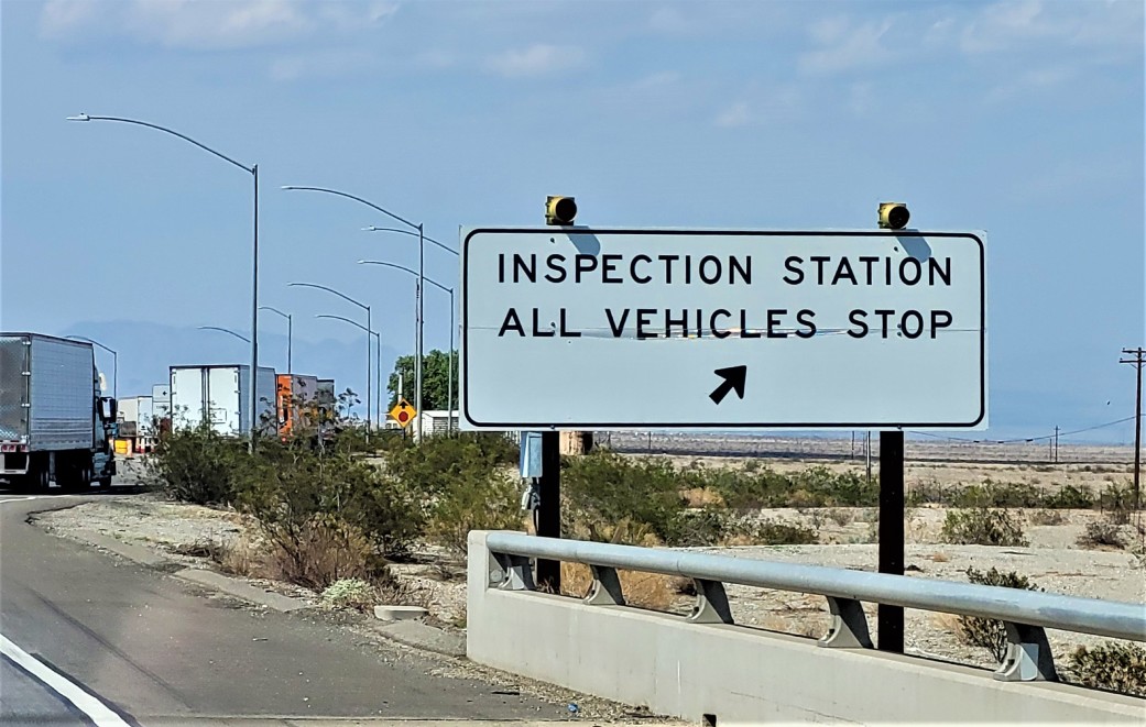 sign for an exit to an inspection station for semi trucks